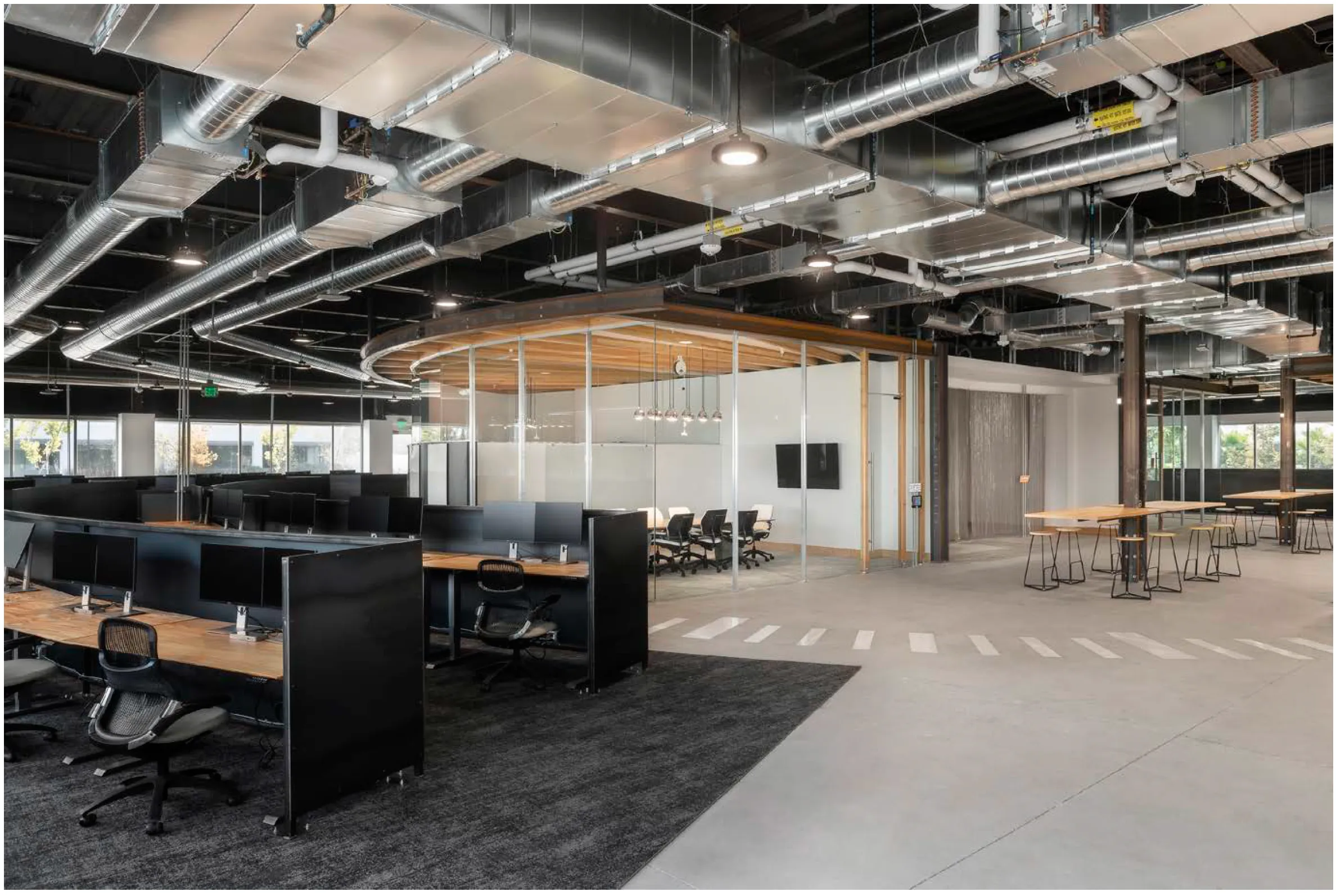 Glass, radiused steel and wood conference room fabricated by Architectural Systems
