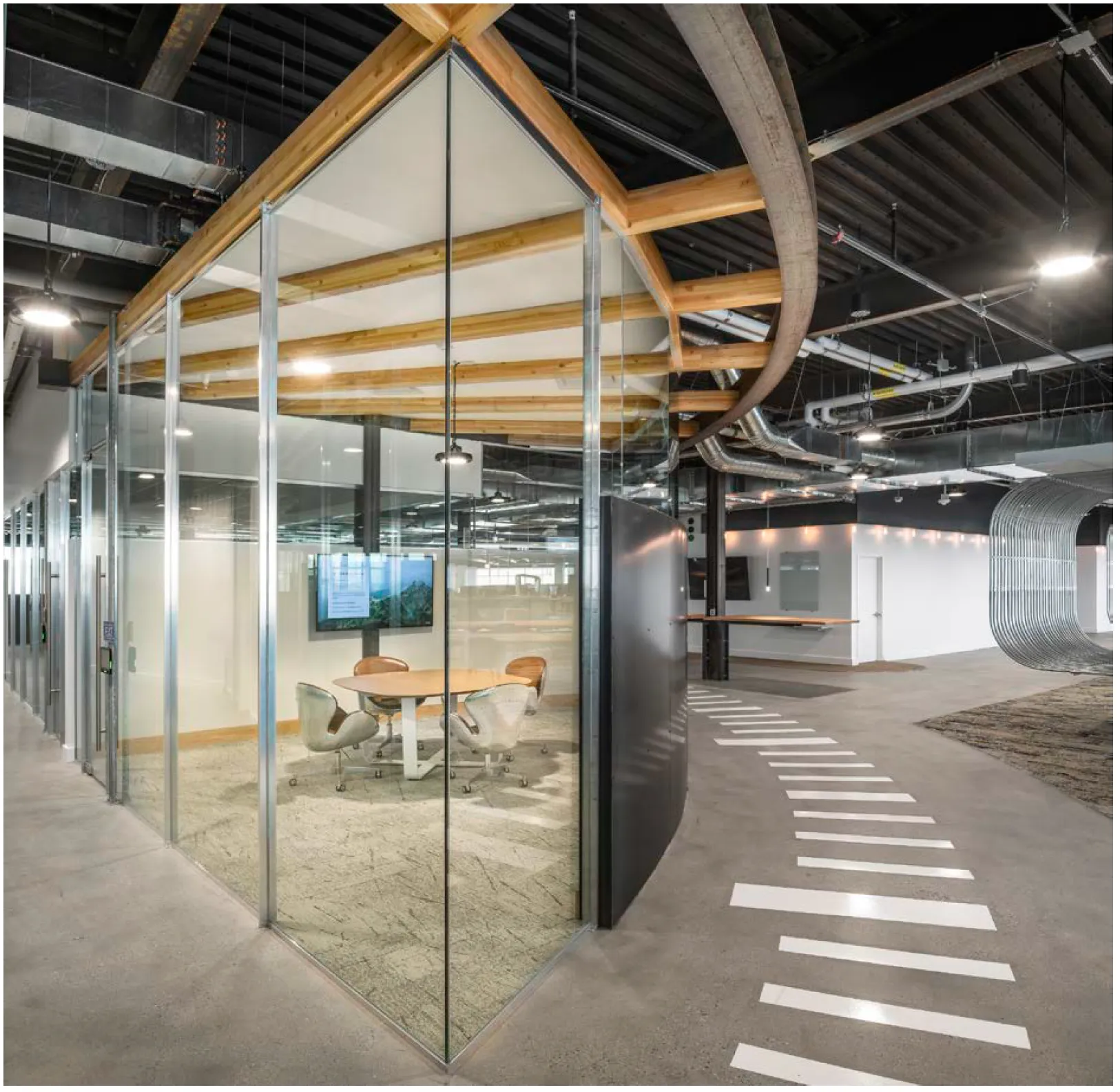 Seating area wrapped in an architectural 'fan coil'