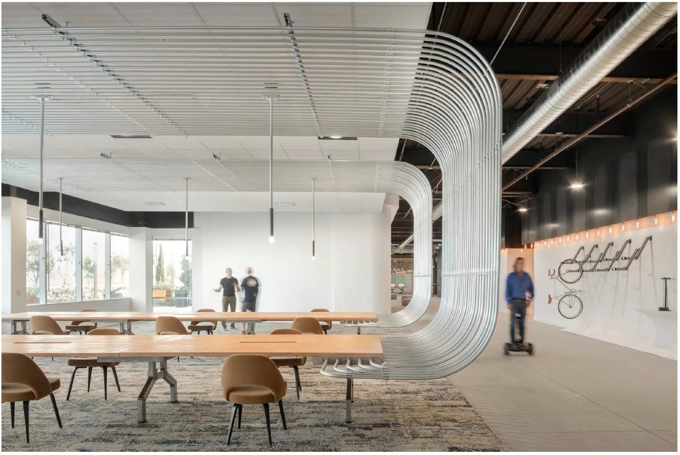 Oblique view of conference room made of glass, radiused steel, wood and acoustical foam