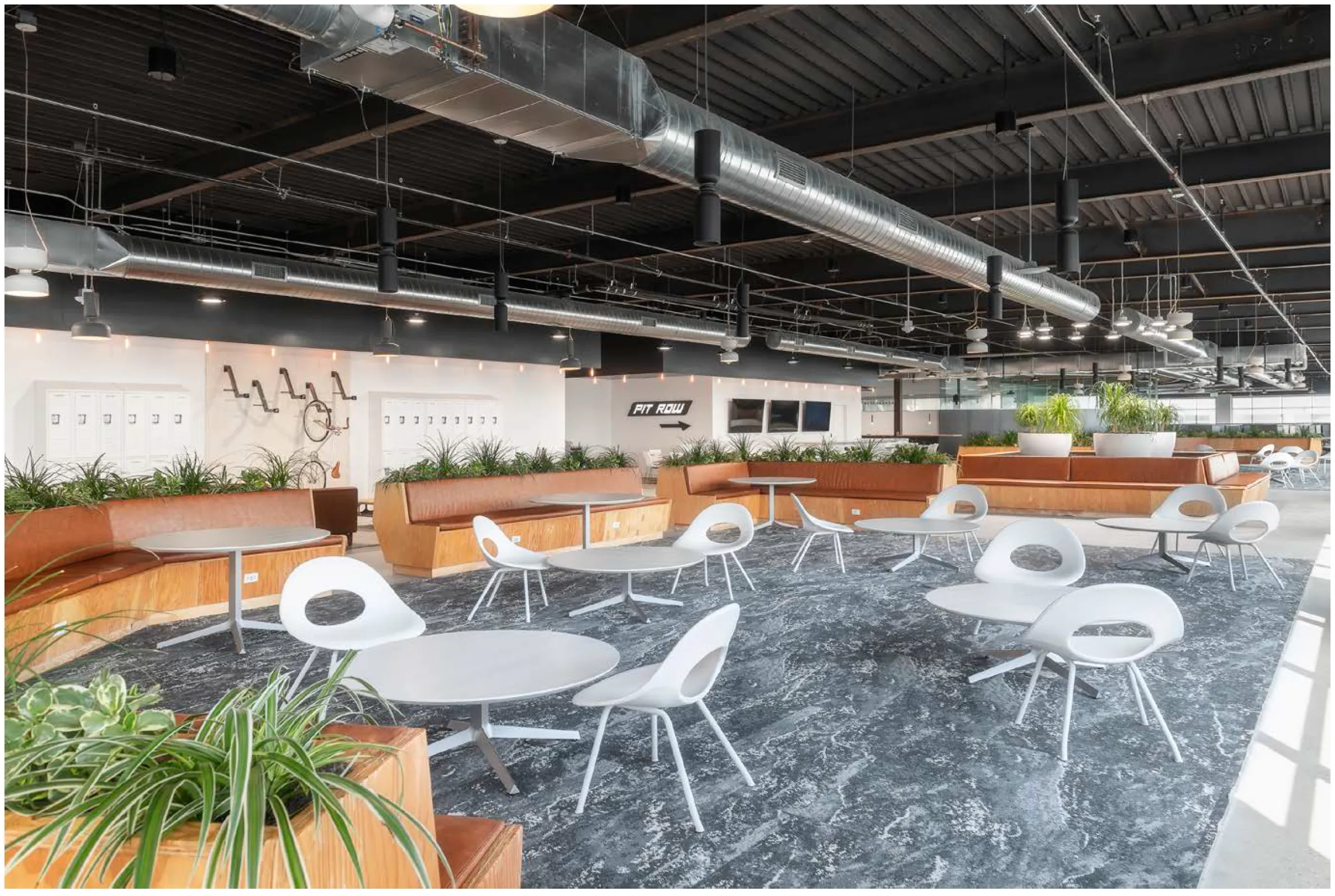 View of west conference rooms with custom seating, tables and bike racks